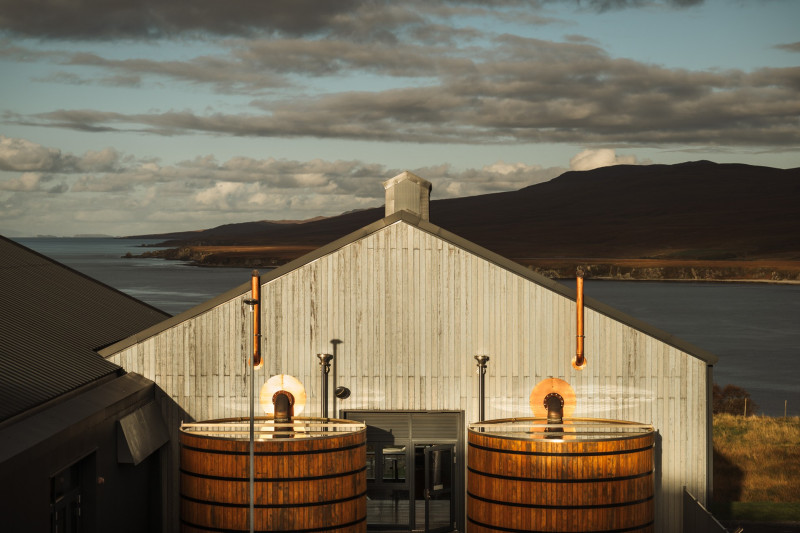 Exterior of Ardnahoe distillery with the eponymous loch in the background