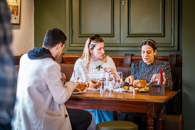 Group of friends having a roast at The Brackenrigg Inn