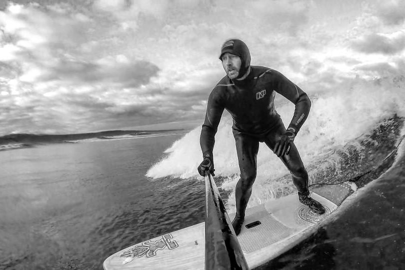 Image of man surfing