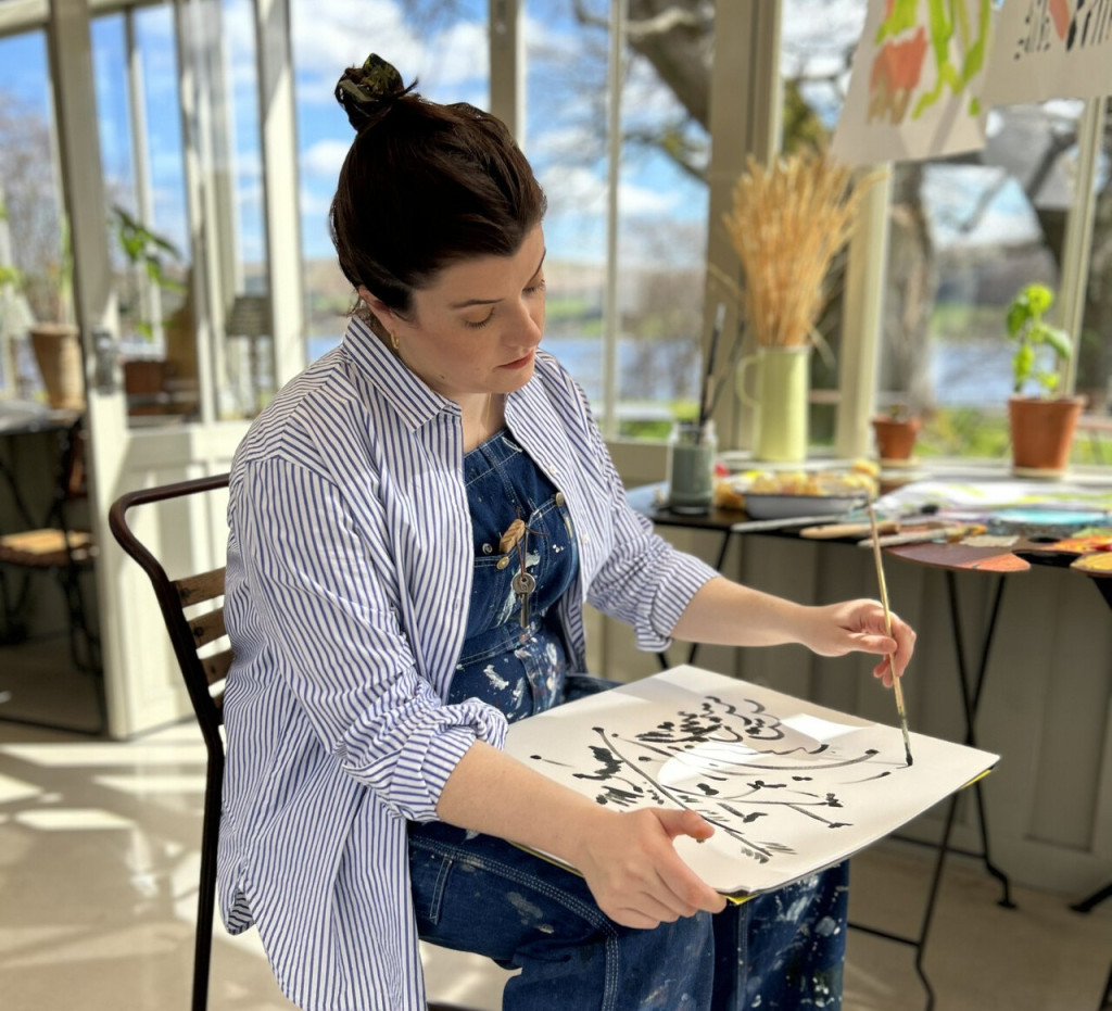 Charlotte Beavor artist in residence painting in the Glasshouse at Another Place the Lake