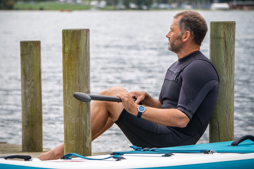 image of man on paddle board