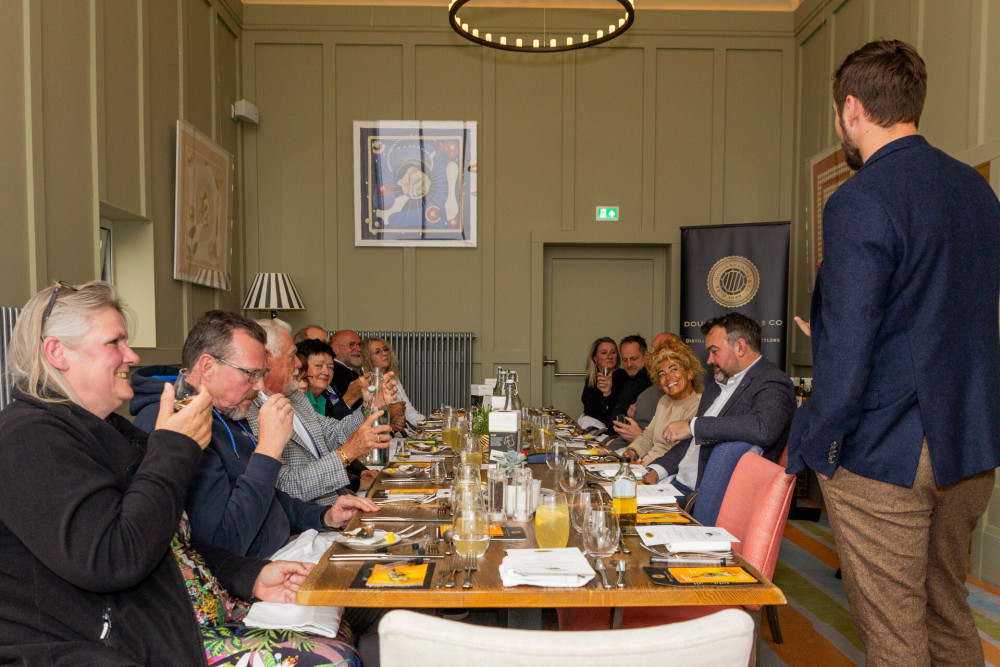 Group of people sat in the tower room at Another Place The Machrie