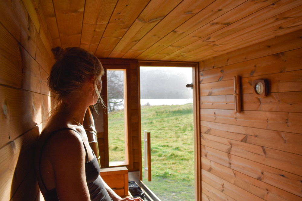 Blonde woman in the Fellside Sauna at Another Place, The Lake in Ullswater