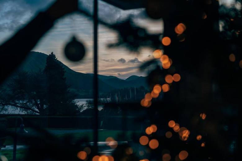 Christmas tree in the window of Another Place, The Lake overlooking ullswater