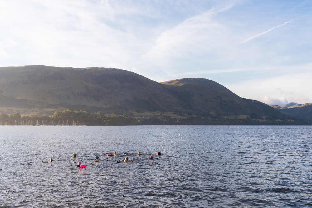 Group in Ullswater lake during a swim camp at Another Place The Lake