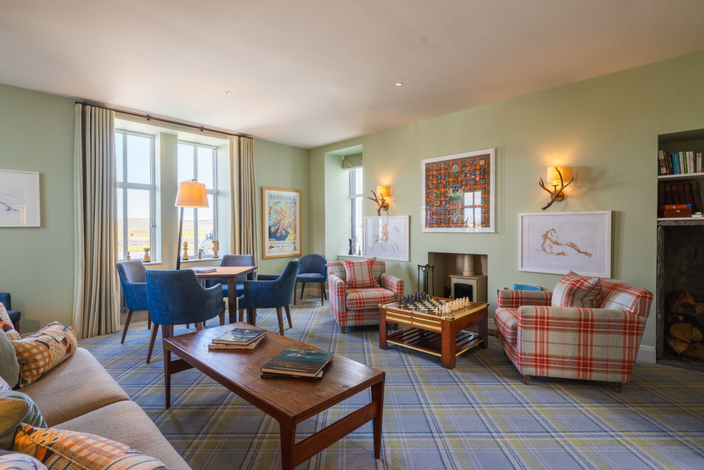 The snug with games and comfy chairs at Another Place, The Machrie