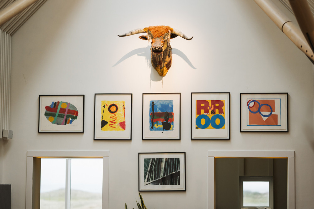 Dougal the cow made of rugs looking over 18 Bar and restaurant at Another Place The Machrie