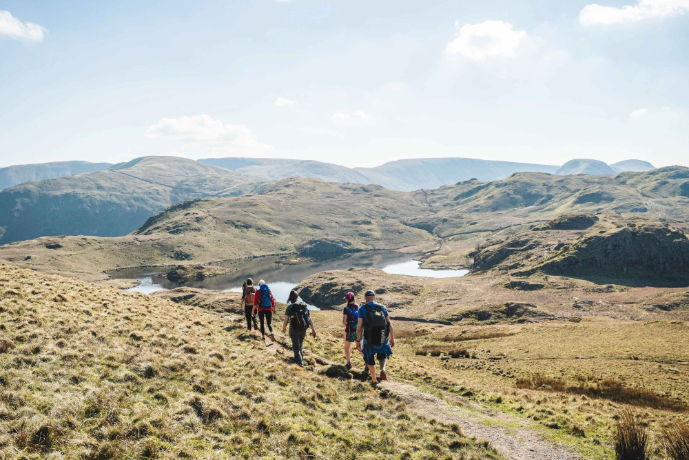 Group of people hiking Angle Tarn
