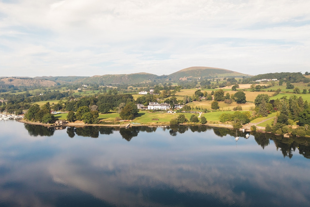 Aerial photo looking from the lake towards Another Place, The Lake on the shores of Ullswater