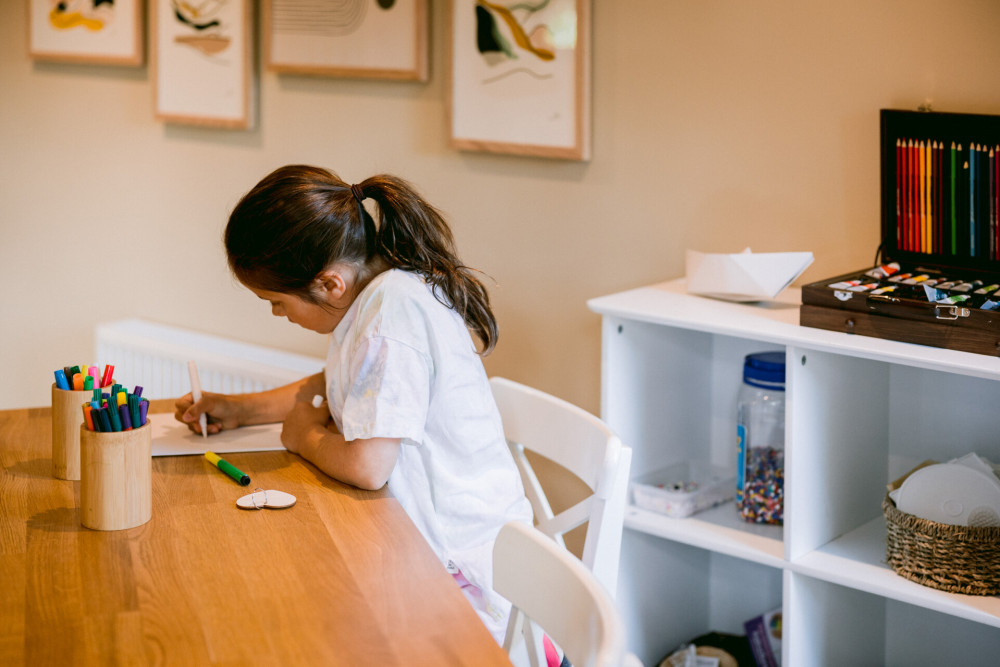 Child colouring in the Kids' Zone