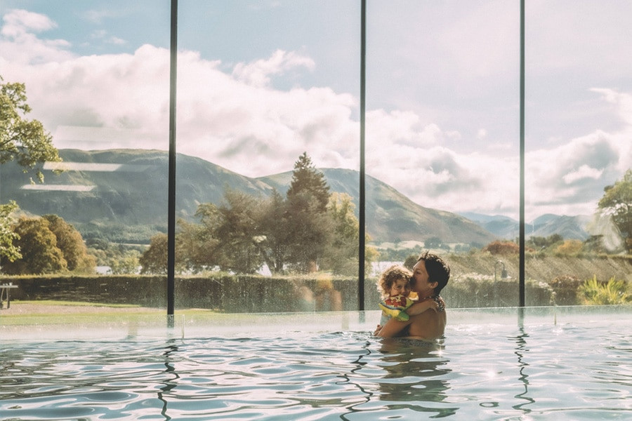 Mother and child swim in pool
